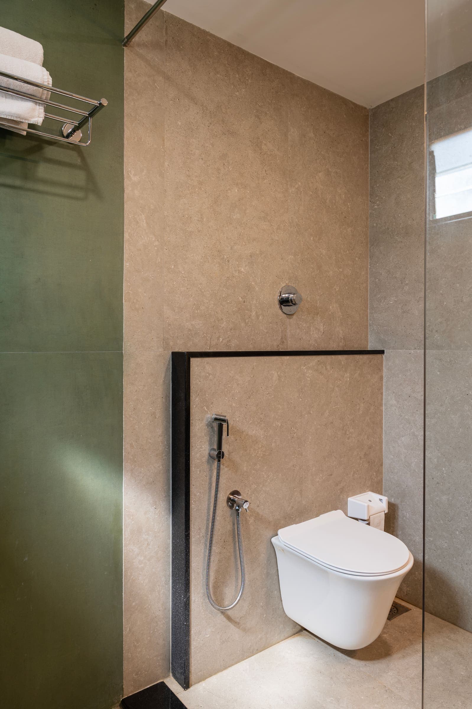 The deluxe bathroom's walk-in wet room with its stone-tiled shower