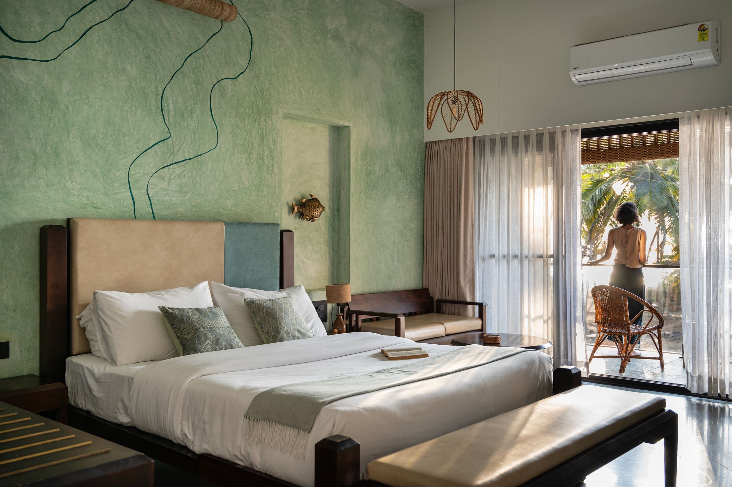 Kubja, in soft river green, opening onto its private sea-facing balcony