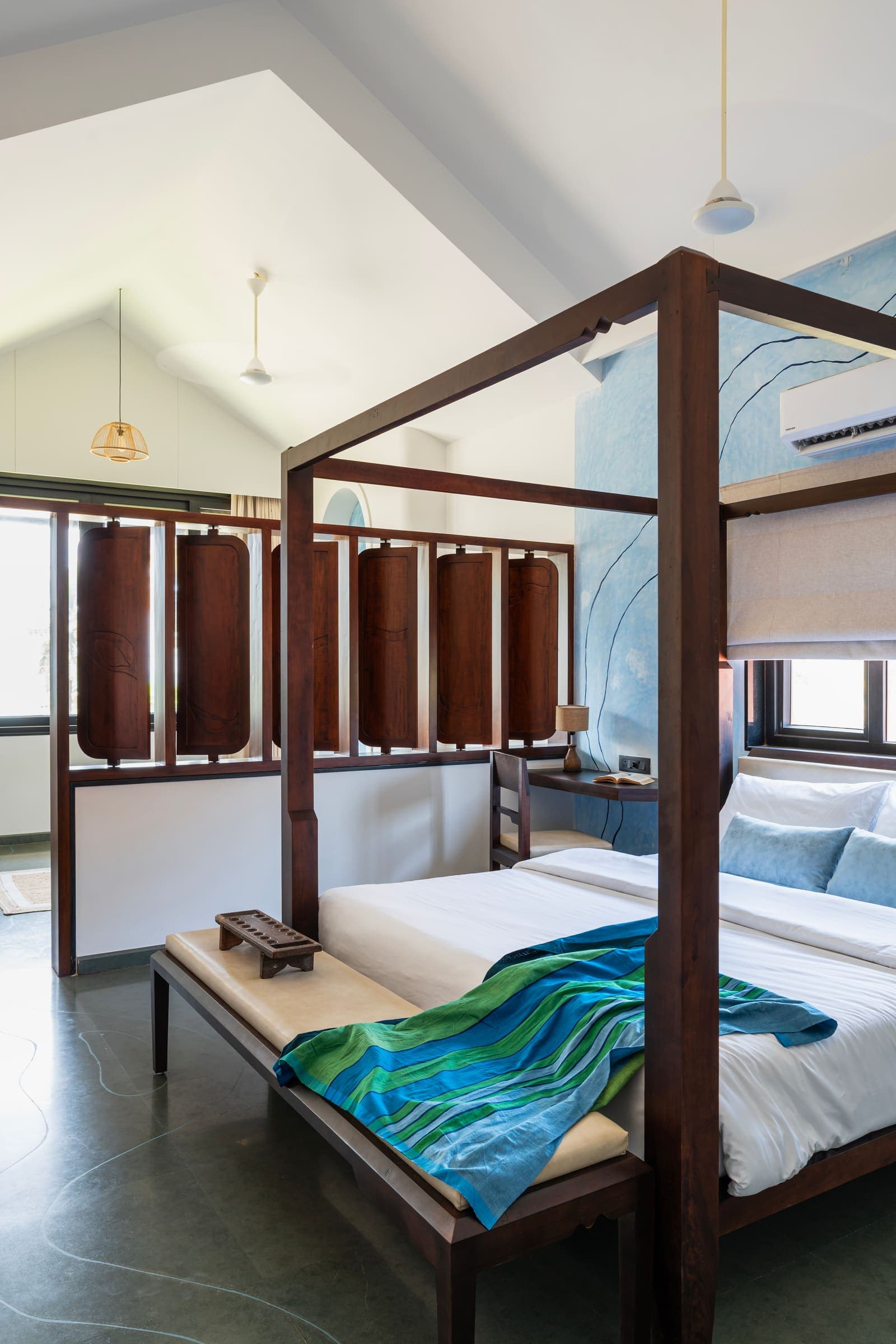 The Varahi master suite with its four-poster bed and vaulted ceiling