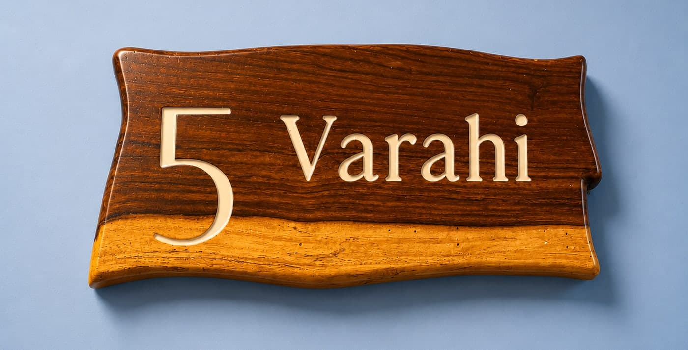 The hand-carved live-edge nameplate for Varahi, room 5